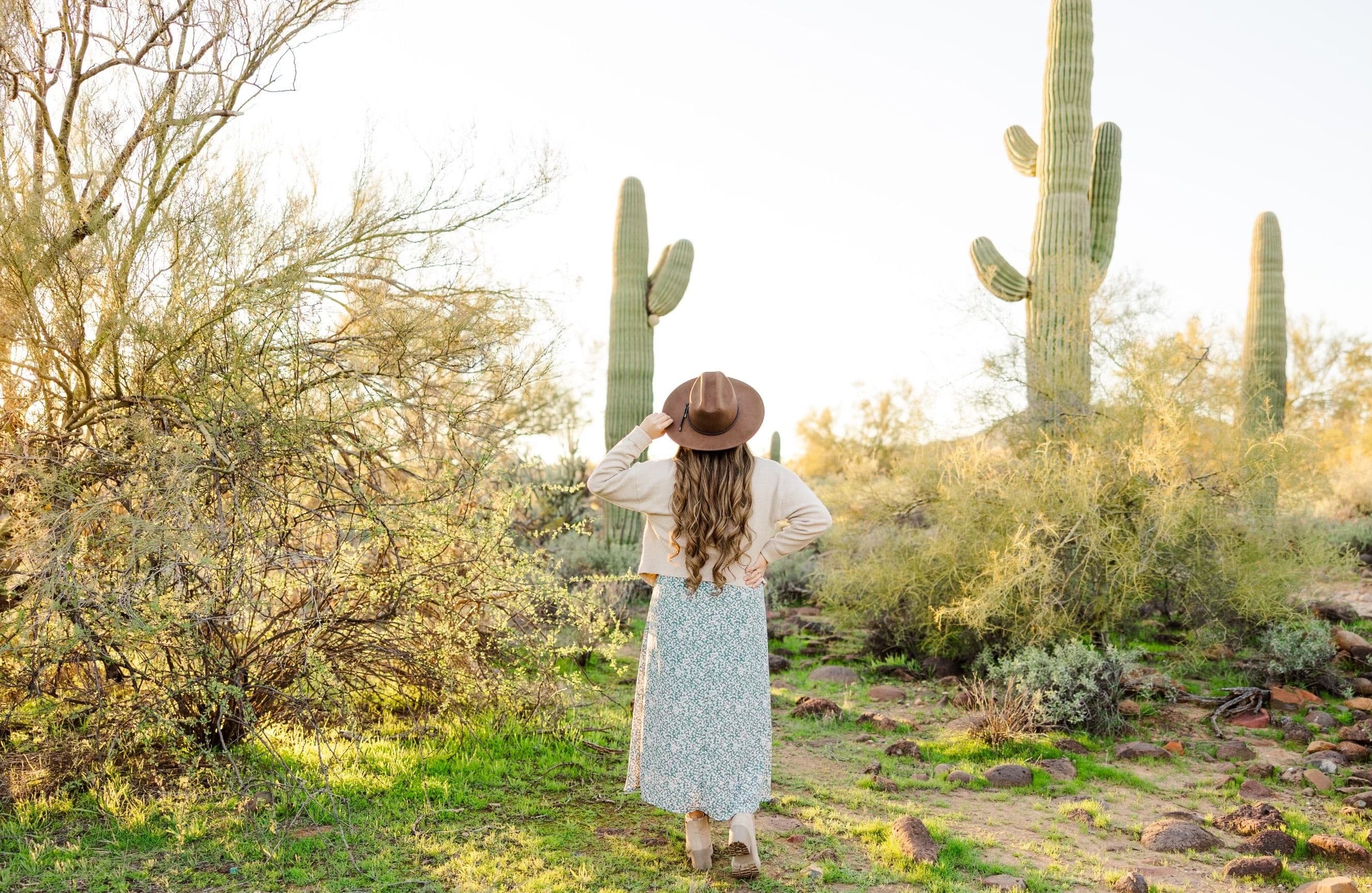 Aimee posing for picture with back towards camera